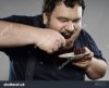 fat-bearded-man-eating-chocolate.jpg
