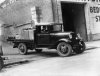 788px-StateLibQld_1_108400_Ford_flat-bed_truck_carrying_the_proceeds_of_crime,_1934.jpg