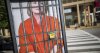 636046123419201275-clinton-behind-bars.JPG